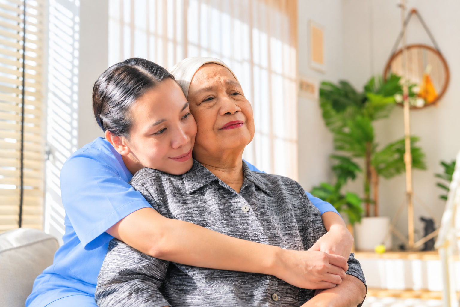 A Golden Heartz caregiver sharing a warm moment with a family